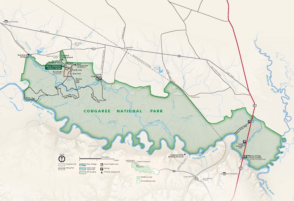 Map of Congaree National Park in South Carolina. The park is highlighted in green with the surrounding area in tan, roads shown as mostly dark gray lines, and waterways in blue.