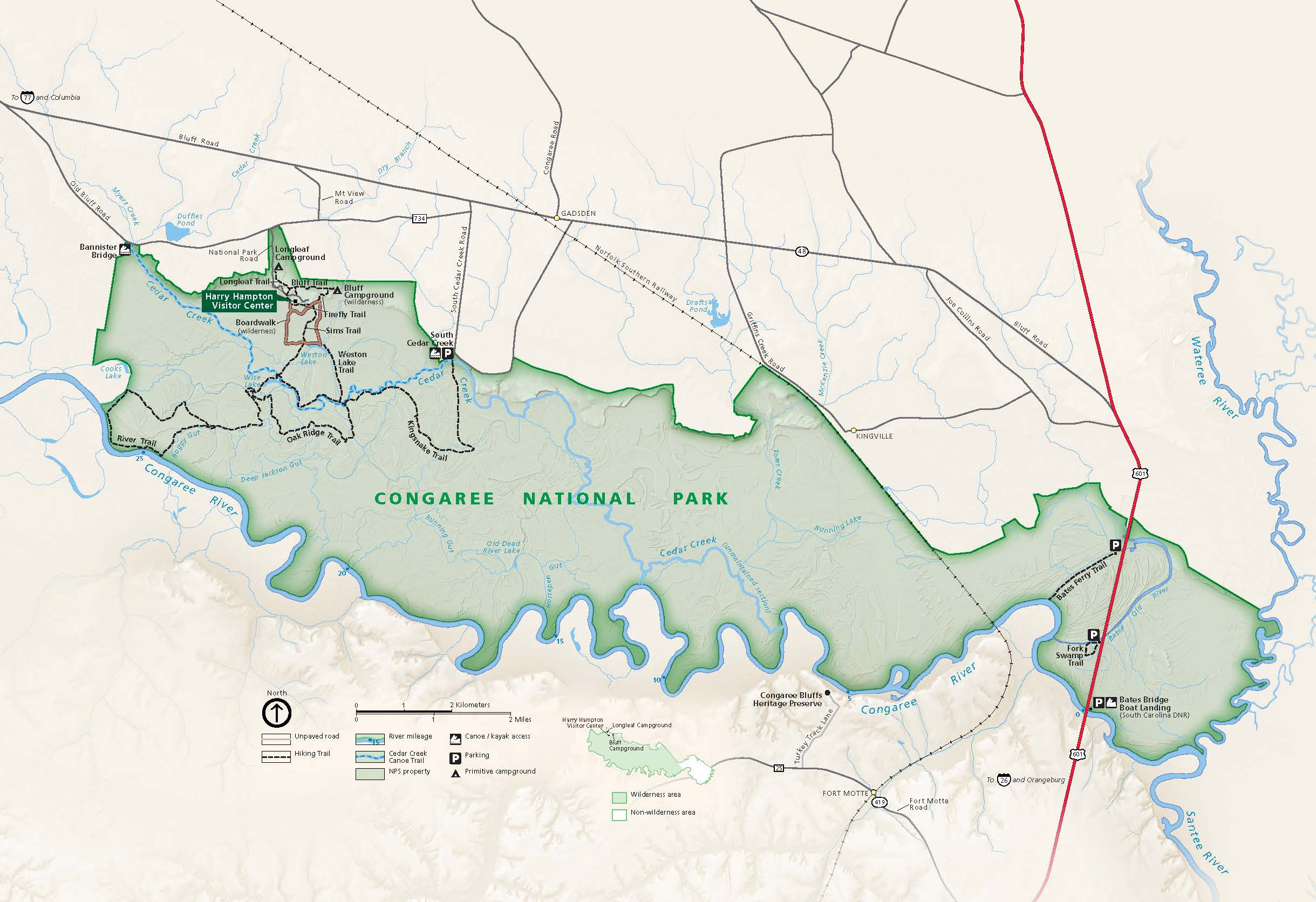 Map of Congaree National Park in South Carolina. The park is highlighted in green with the surrounding area in tan, roads shown as mostly dark gray lines, and waterways in blue.