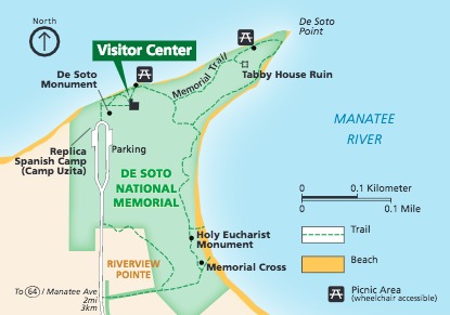 Map of De Soto National Memorial, which covers most of a peninsula surrounded by the Manatee River in Florida. The water is blue around the park, which is shown in green. Trails, picnic areas, and several sites are labeled. 