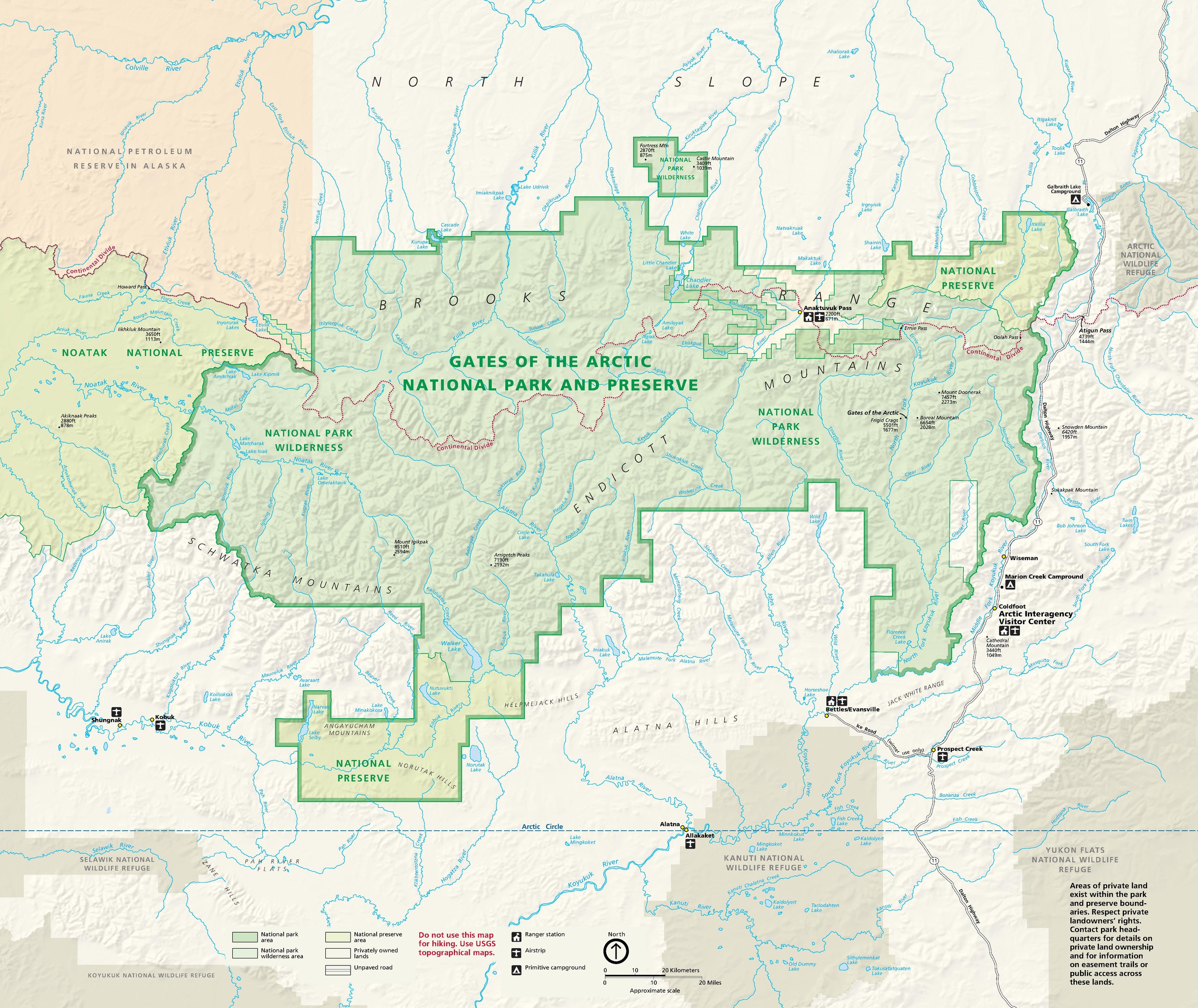 Map of Gates of the Arctic National Park and Preserve in Alaska. Shown in green and surrounded in beige, the preserve has an irregular shape with stepped edges and is veined with dozens of rivers in blue.