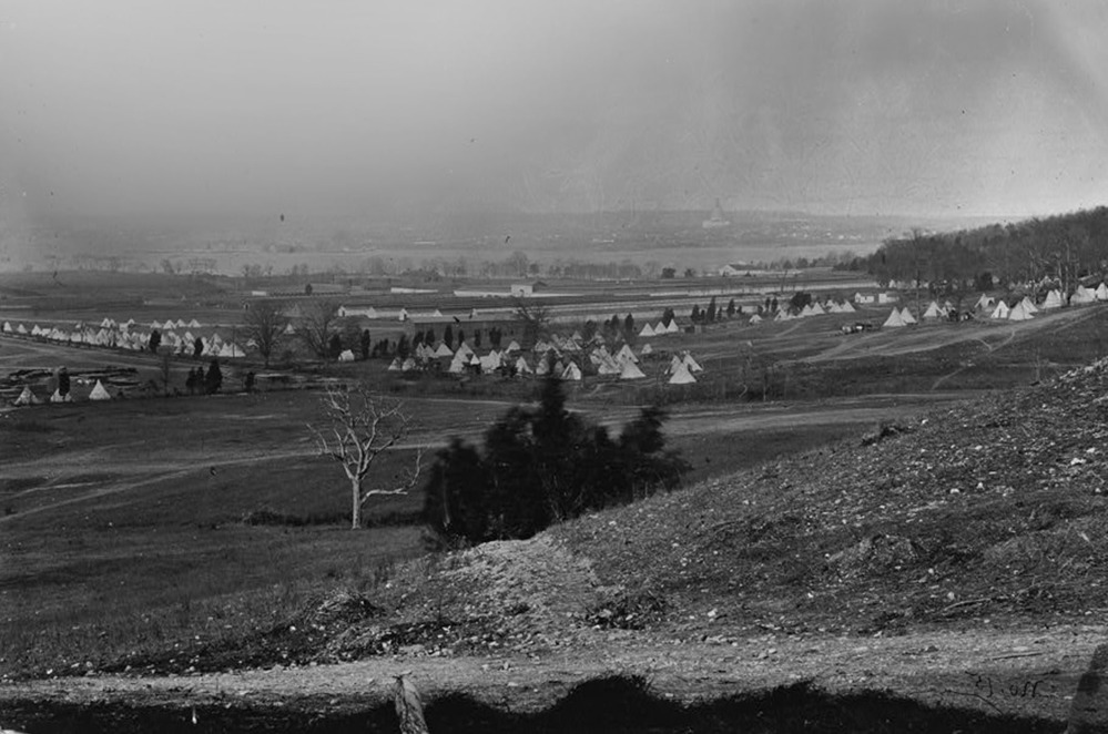 This May 1864 photograph was taken from a ridge overlooking Camp Stoneman. The photo looks towards the Anacostia River and the US Capitol can be discerned in the distant right center.