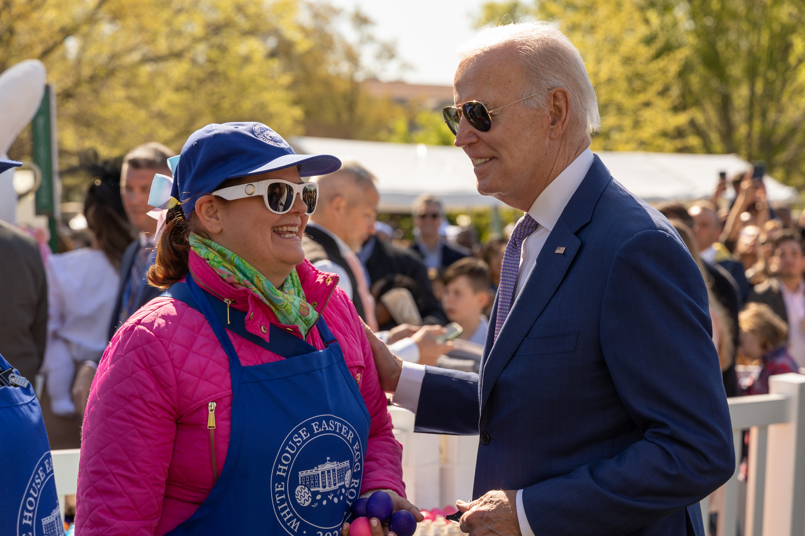 President Joe Biden meets with a volunteer at the 2023 White House Easter Egg Roll