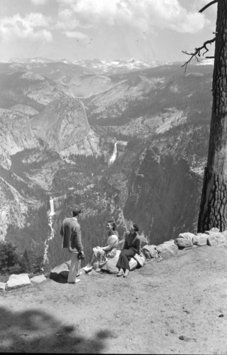 People looking out over high country.