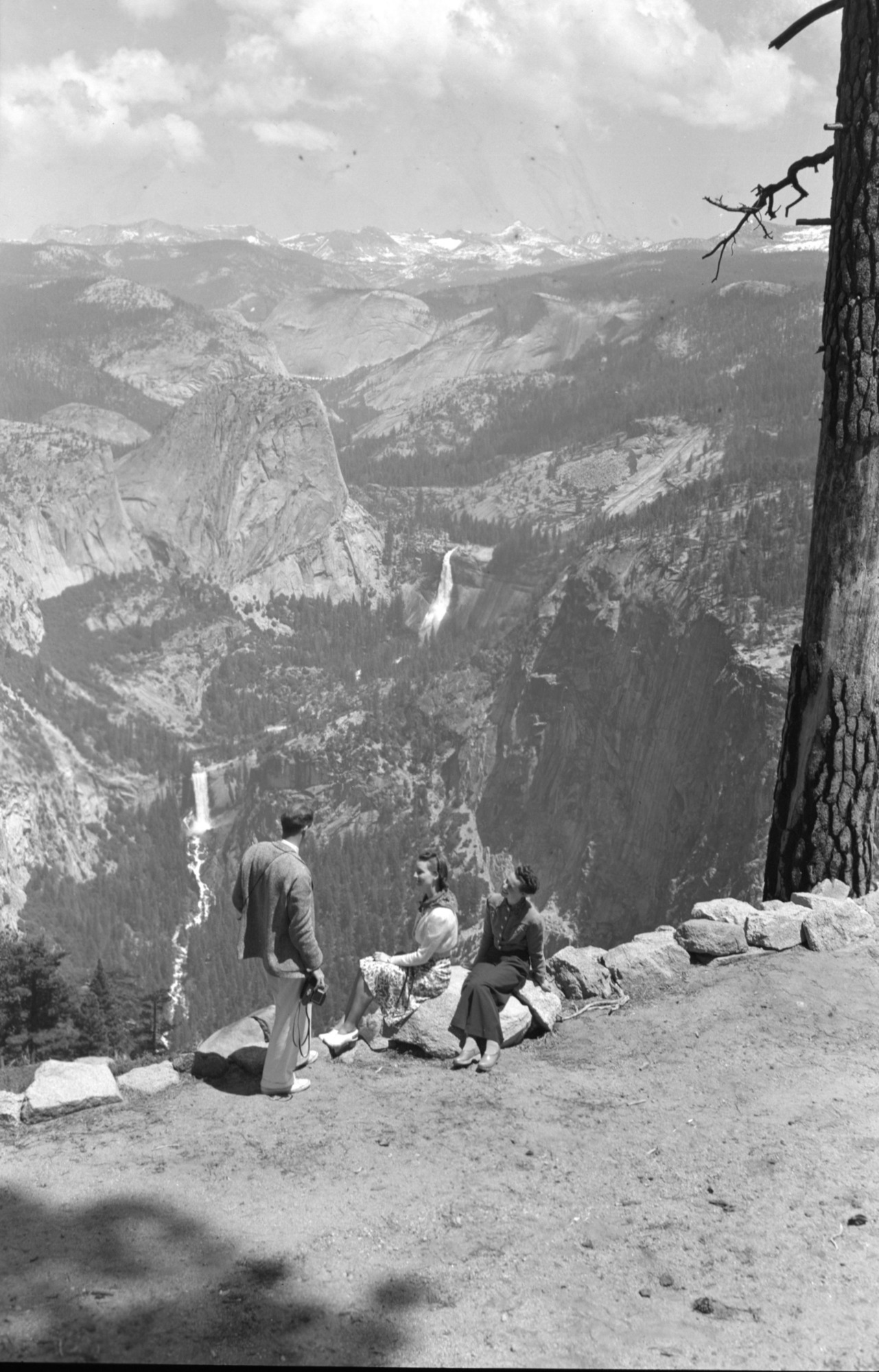 People looking out over high country.