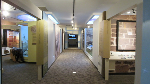 View of a hallway with the entrance to museum galleries visible on the side.