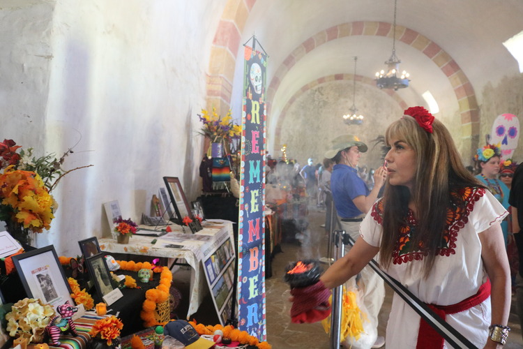 Woman blessing an altar. 