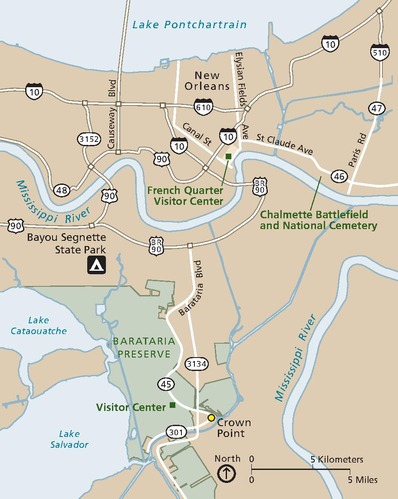 Map of Barataria Preserve in Jean Lafitte National Historical Park and Preserve in Louisiana. The preserve is shown in green, surrounding areas in tan, roads in white, and the water in blue.