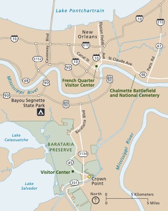 Map of Barataria Preserve in Jean Lafitte National Historical Park and Preserve in Louisiana. The preserve is shown in green, surrounding areas in tan, roads in white, and the water in blue.