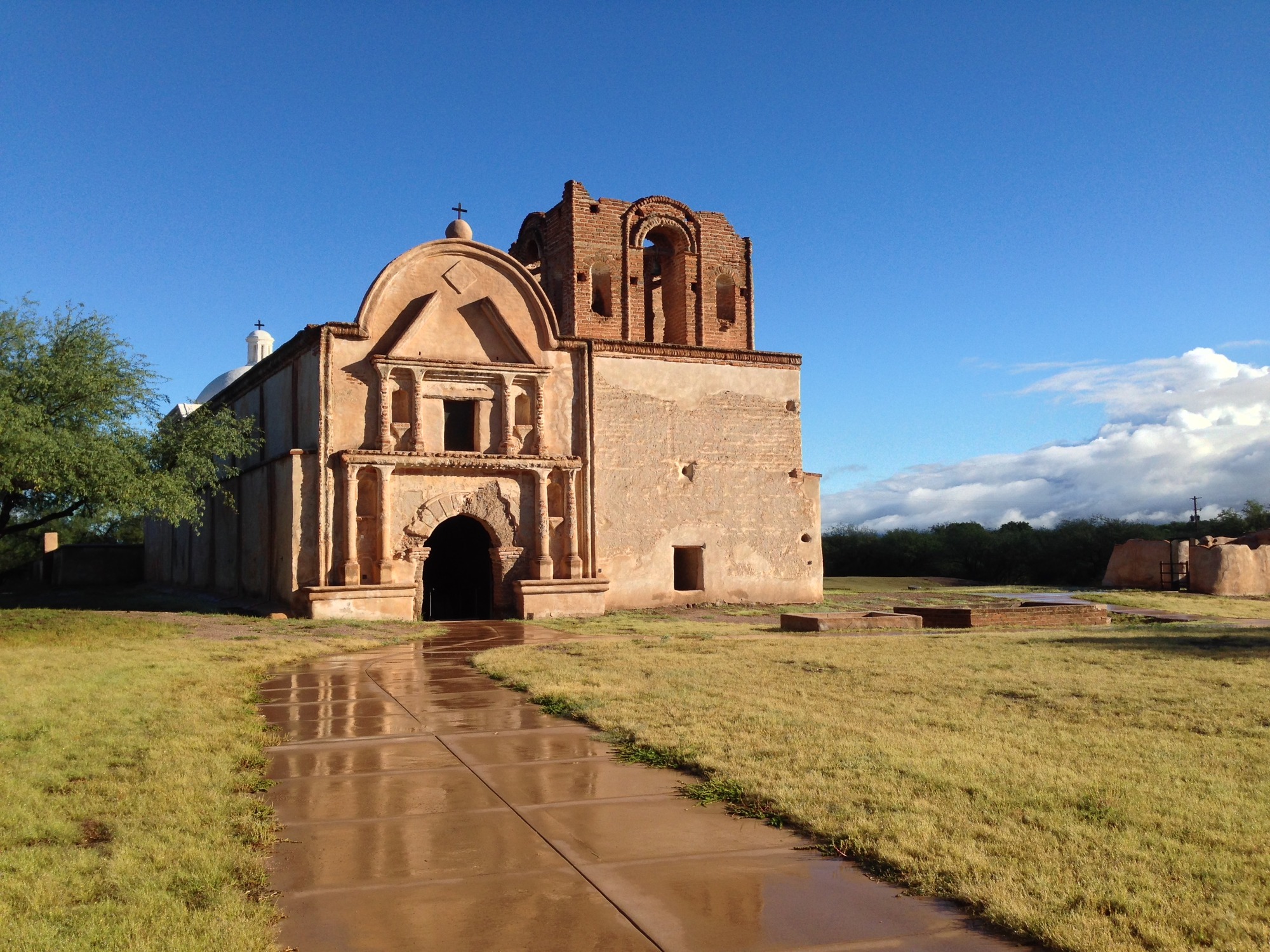 mission church with wet sidewalk
