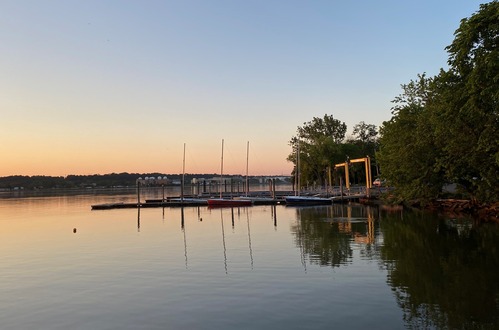 A marina on a river at sunrise 