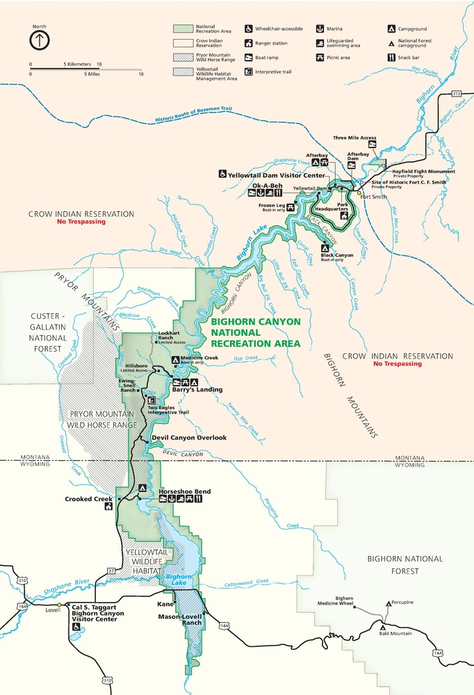 Map of Bighorn Canyon National Recreation Area in Montana. Shown in sage green, the inverted comma-shaped site stretches from north central Wyoming into the south-central region of Montana.