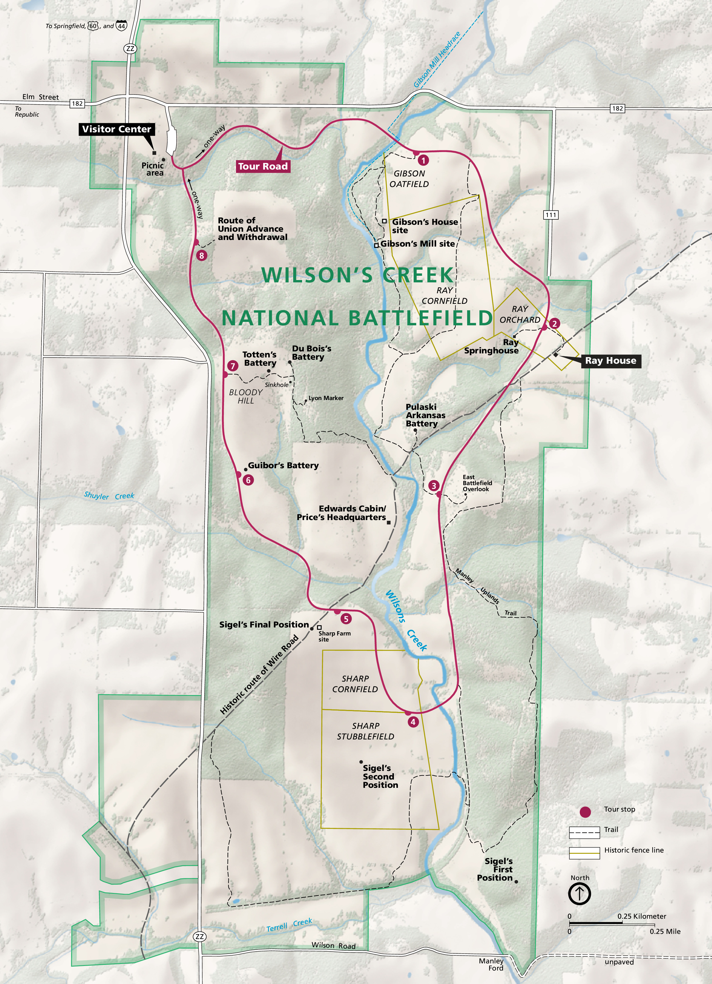 Map of Wilson’s Creek National Battlefield in Missouri. Spanning the map from north to south, the roughly rectangular site is shown in sage green with pockets of beige and a dark magenta Tour Road with 8 numbered stops. The surrounding terrain is pale green and ivory white.