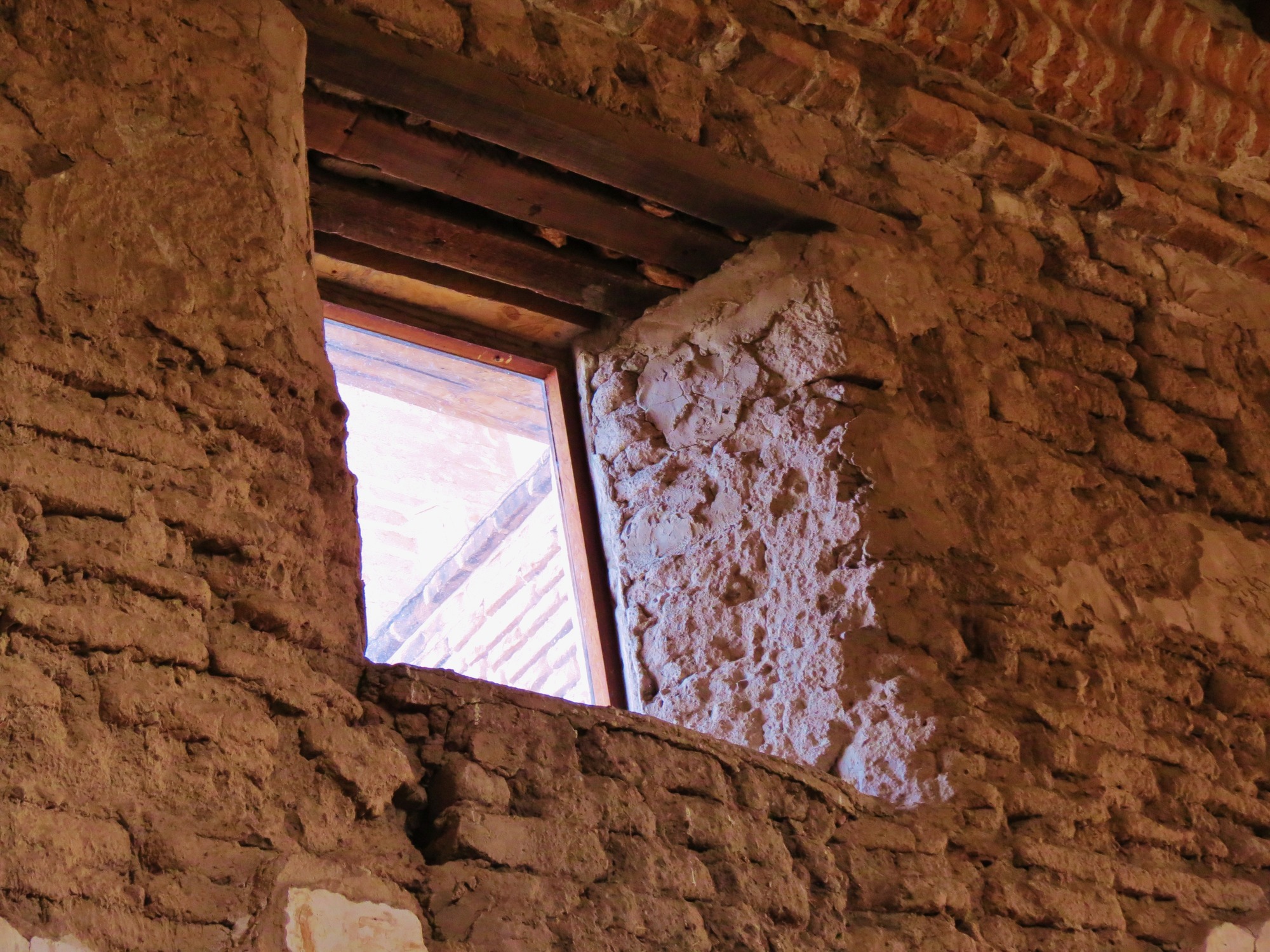 Interior of mission church nave, window detail