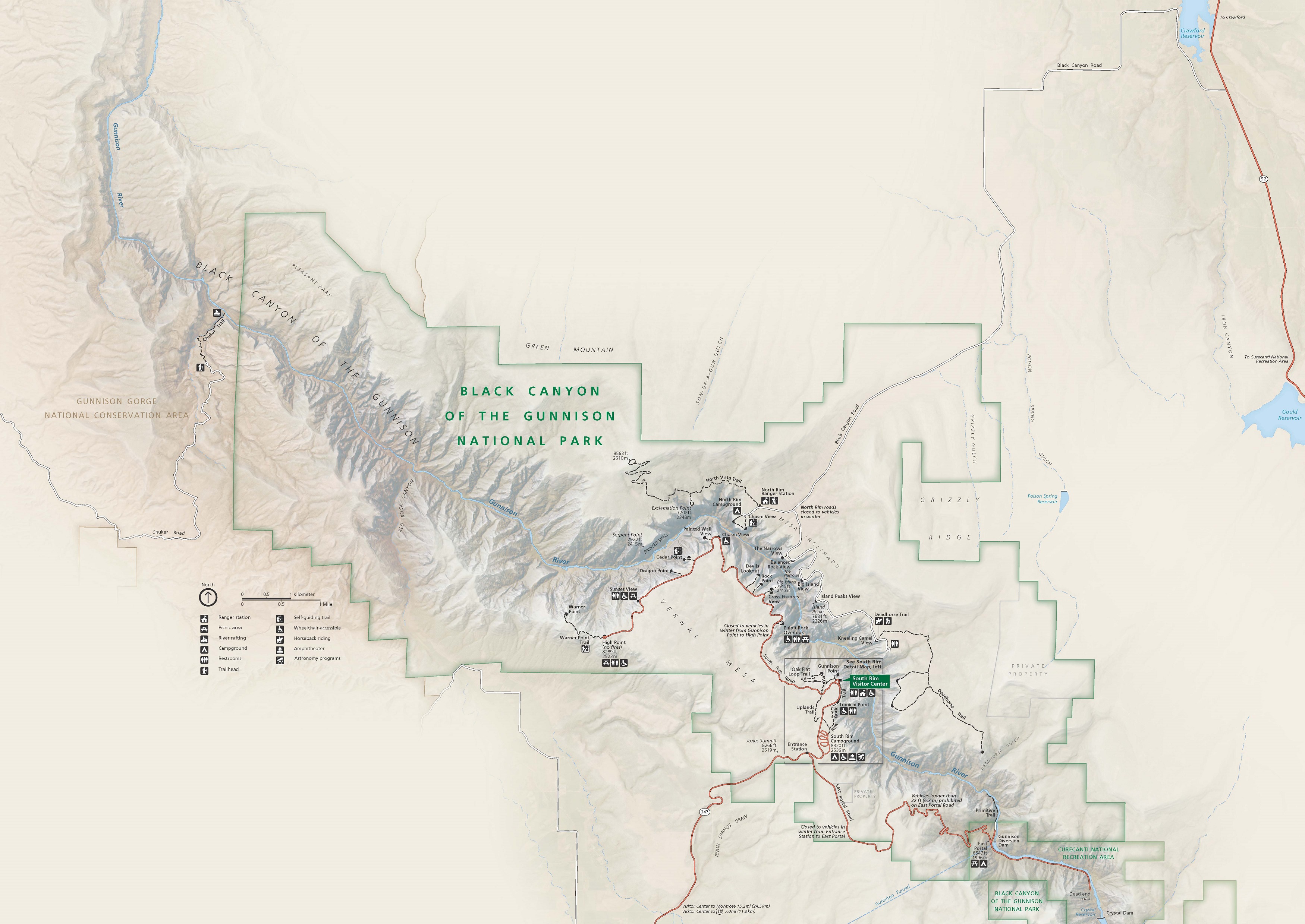 Map of Black Canyon of Gunnison National Park in Colorado. Park areas are outlined in green and surround a curved stretch of the Gunnison River. The beige land is shaded to show terrain, and bodies of water are blue.