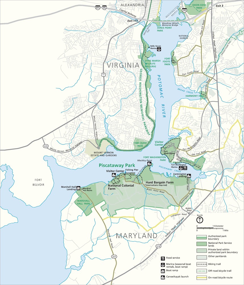 Map of Piscataway Park on the Potomac River in Maryland. Park areas are shown in green, the surrounding areas in eggshell white, the water in blue, and roads in gray.