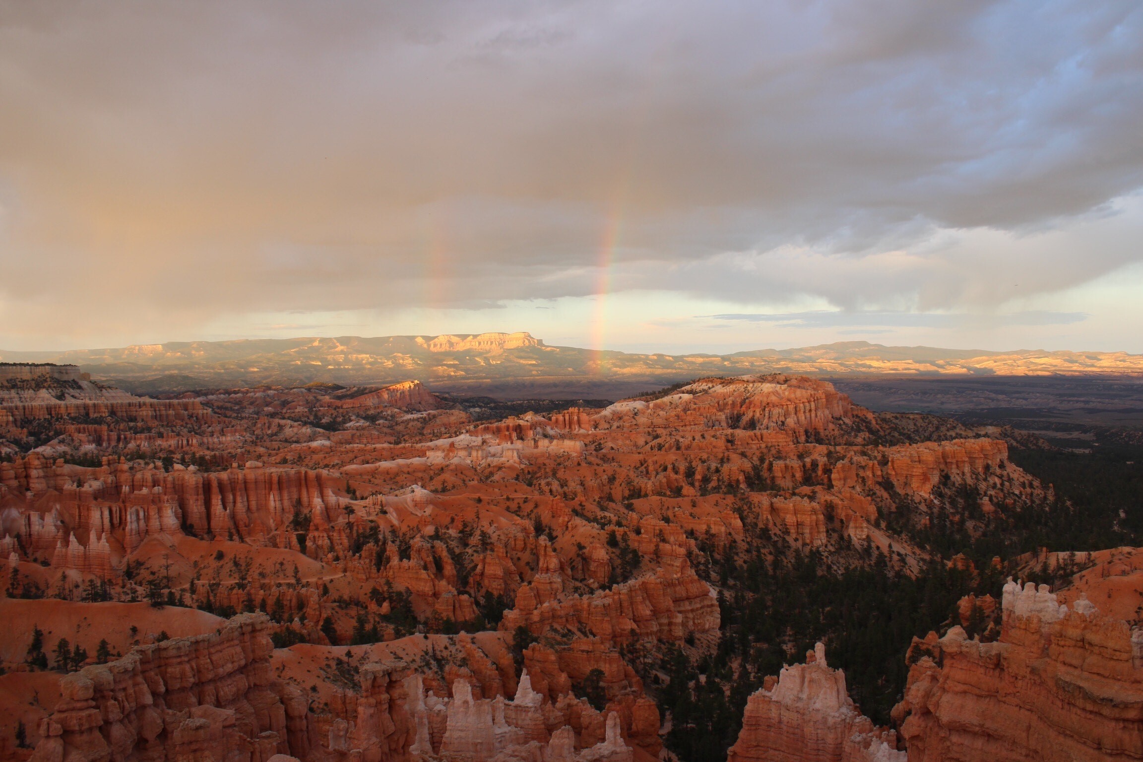 A rainbow over the red rock formations of the Bryce Canyon amphitheater.