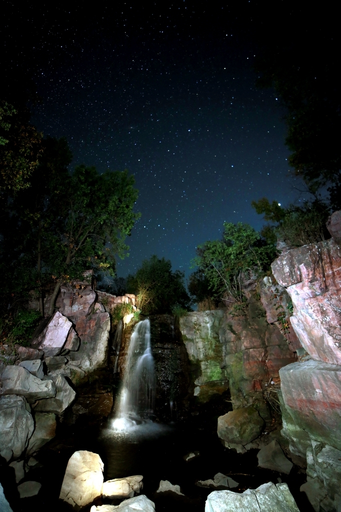waterfall at night under stars