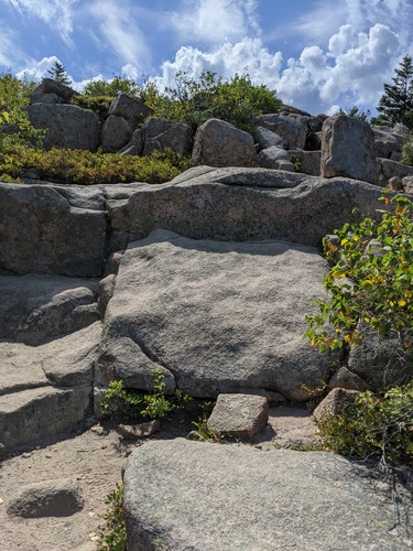 Small boulders and rocky, exposed areas on a trail