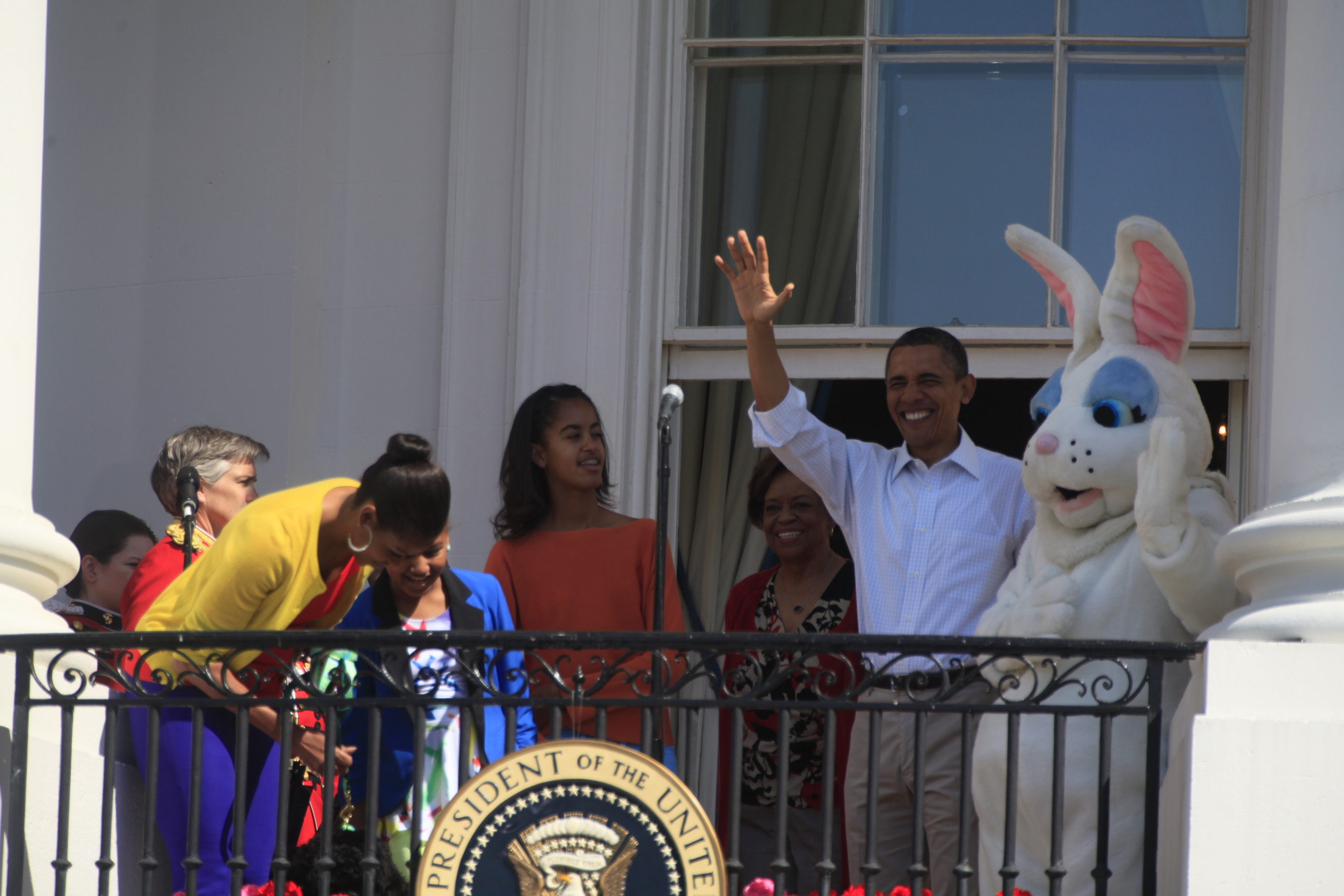 President Barack Obama and the Easter Bunny wave to the crowd. 