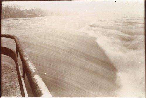 A photo showing Flood waters surging over Pawtucket Dam