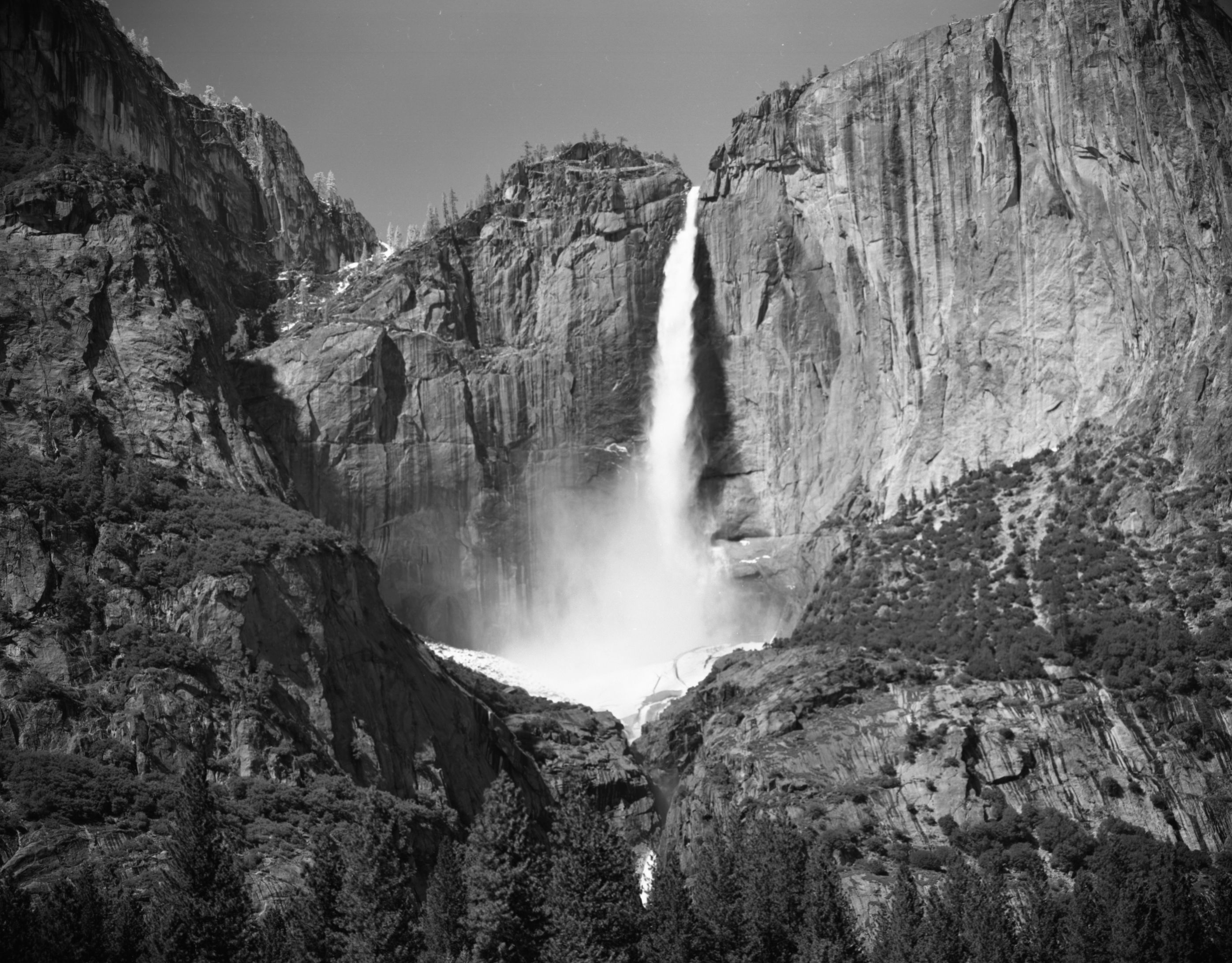 Yosemite Falls: Upper fall from road side west of Chapel. Record of snow cone demise.