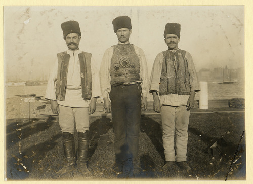 Three men in traditional dress.