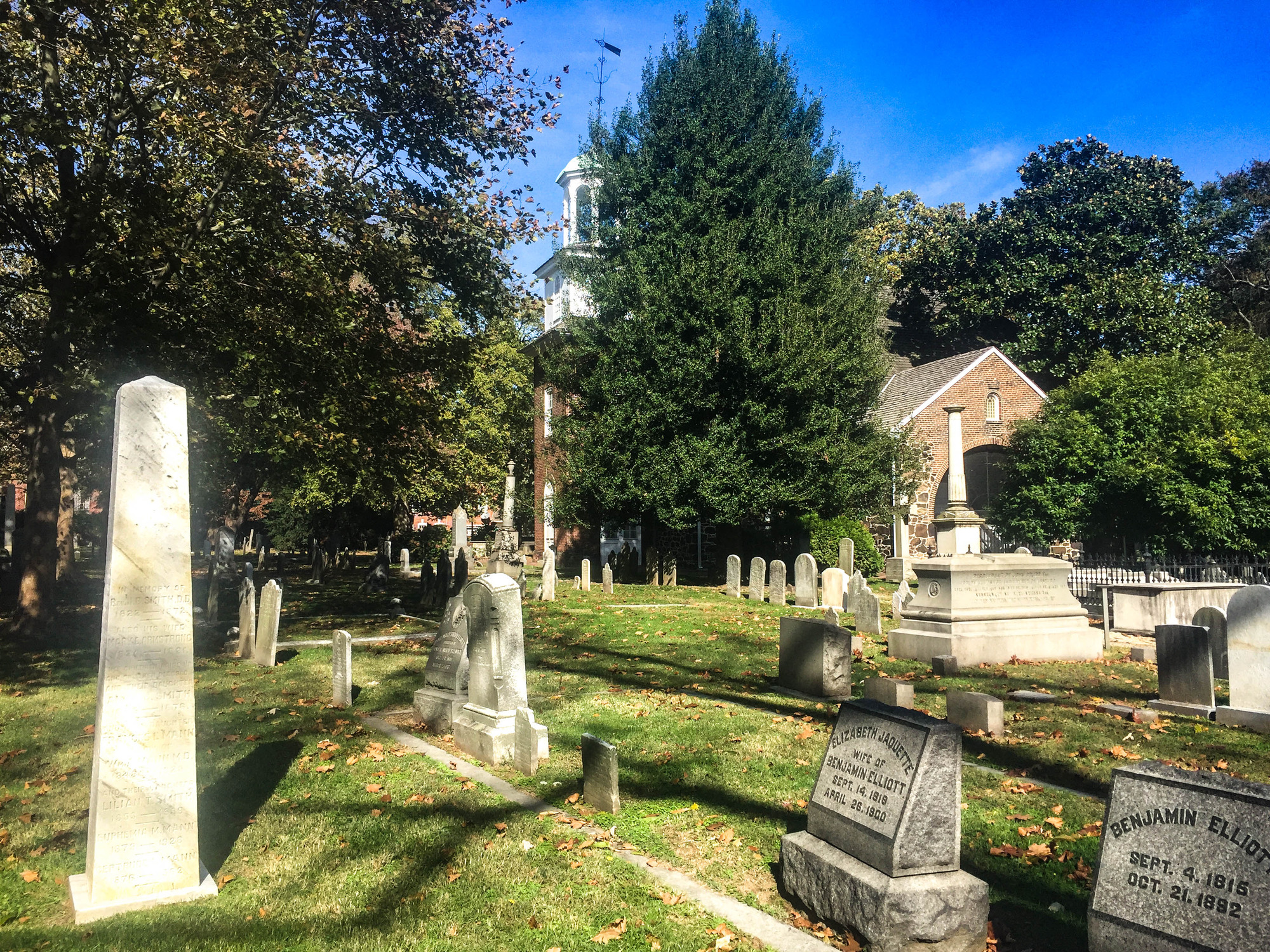 Brick church surrounded by a churchyard cemetery 
