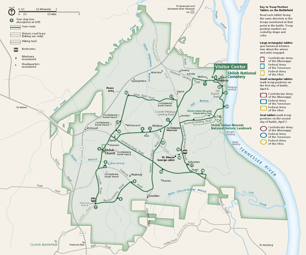Map of Shiloh National Military Park in Tennessee. The park is outlined and shaded in green, and the surrounding area is in beige. The Tennessee River, represented in blue, curves down the east border of the park. A tour route is shown with a green line and passes 22 numbered sites.