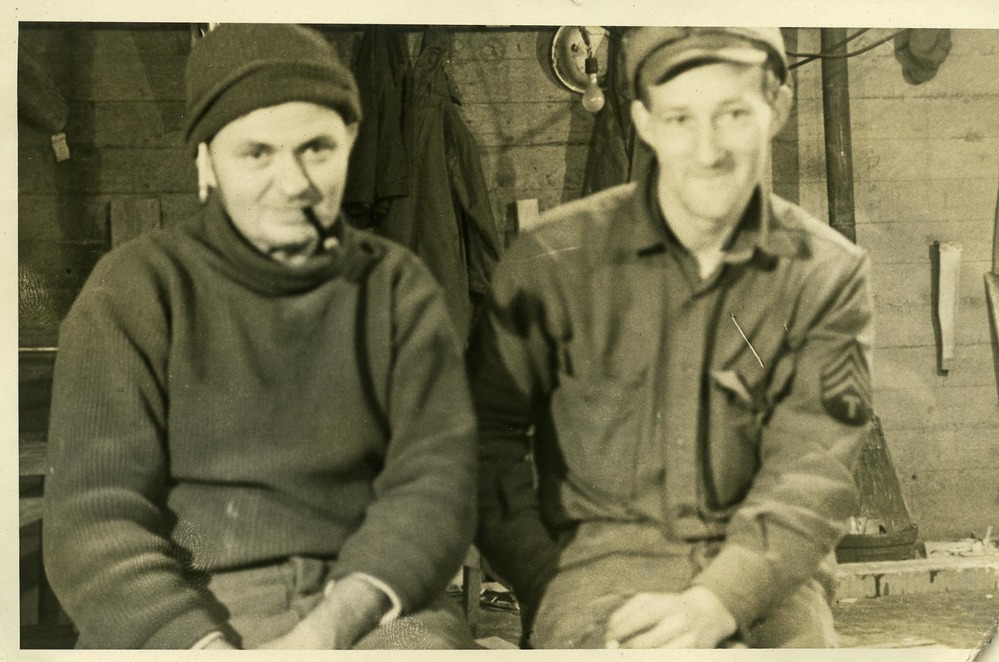 Two men posing for camera