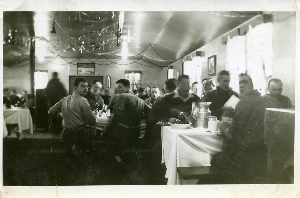 Men seated at dining tables