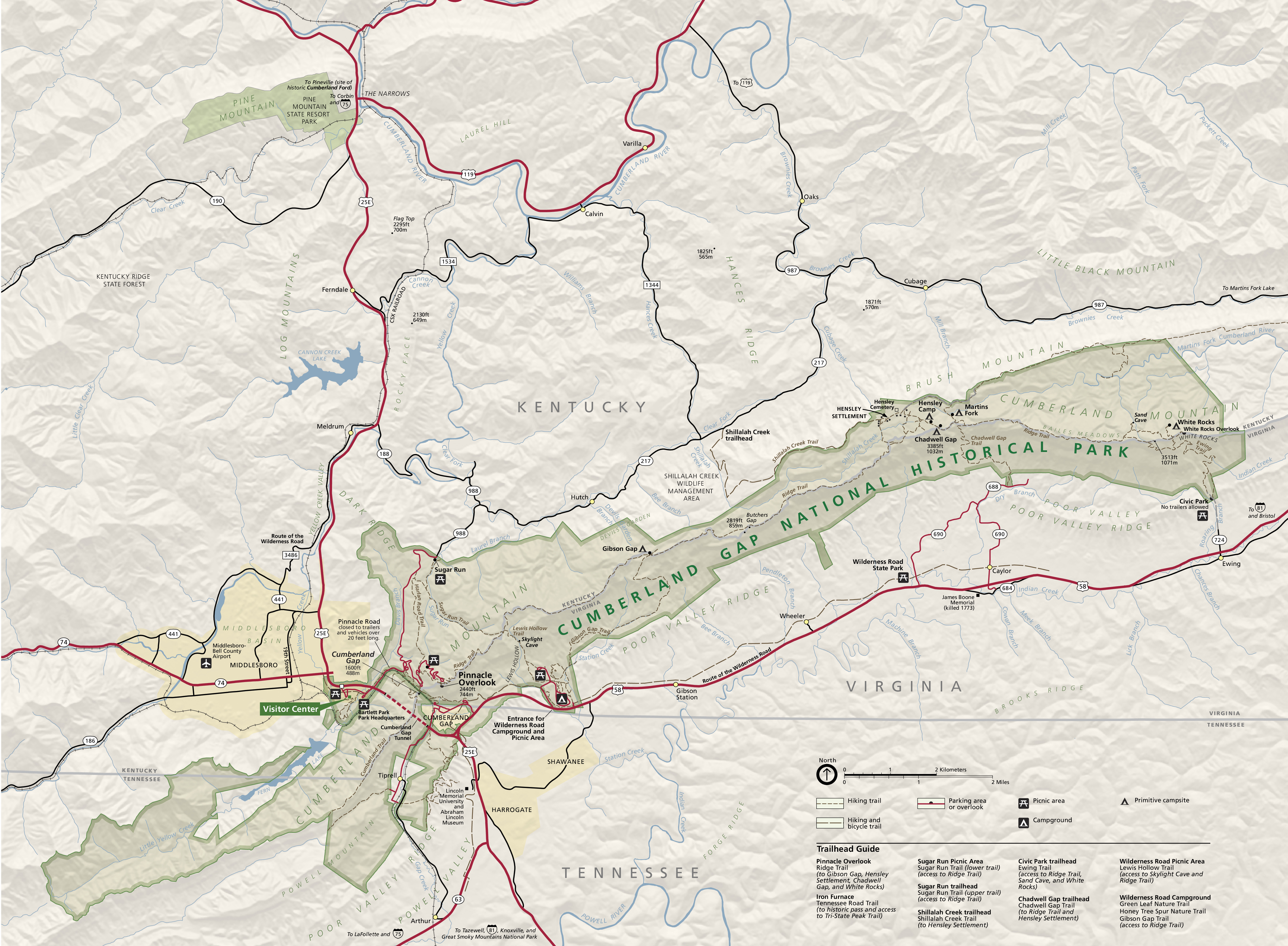 Map of the Cumberland Gap National Historical Park that encompasses portions of Kentucky, Tennessee, and Virginia. The park is shown in muted green, the surrounding terrain in shimmering tan, and roads as red or black lines.