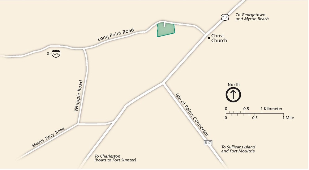 Park map of the Charles Pinckney National Historic Site in South Carolina. The map is tan with roads shown in white. The park is designated by a small green square near the middle of the upper edge of the map.