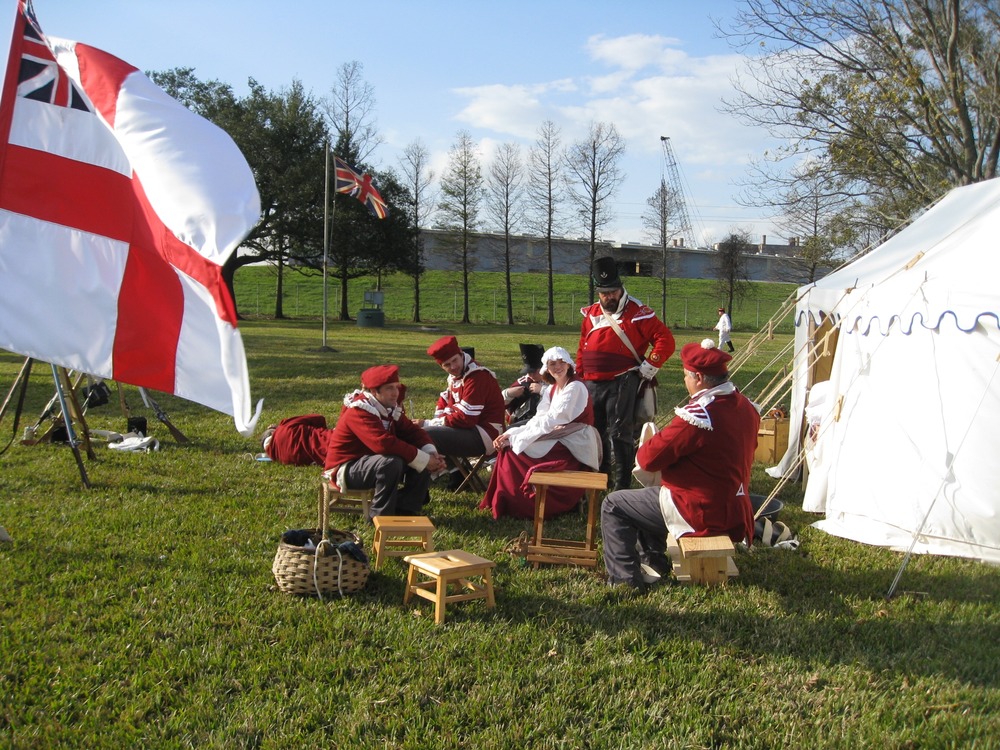 At the British camp, soldiers and a camp follower enjoy a rare moment of leisure