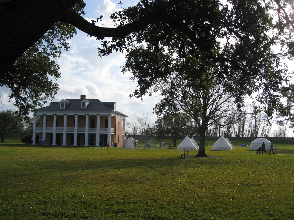 Tents surround the headquarters of the British army, located in a house just downriver from New Orleans