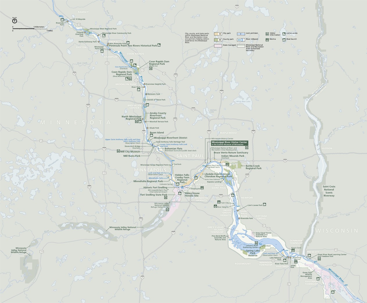 Map of Mississippi National River and Recreation Area in Minnesota. The Mississippi River ripples gently from near the top left corner of the map down into the bottom right corner. The river is shown in blue, other waterways in paler blue, parks in green or yellow, and the surrounding terrain in frosty green.