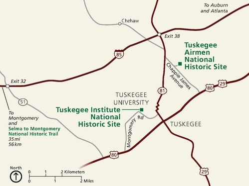 Area map of Tuskegee Airmen National Historic Site in Alabama. The park is found in the eastern third of the map, while the city of Tuskegee, Tuskegee University, and the Tuskegee Institute National Historic Site are west of the park, near the center of the map. The land is colored beige and the roads maroon red.