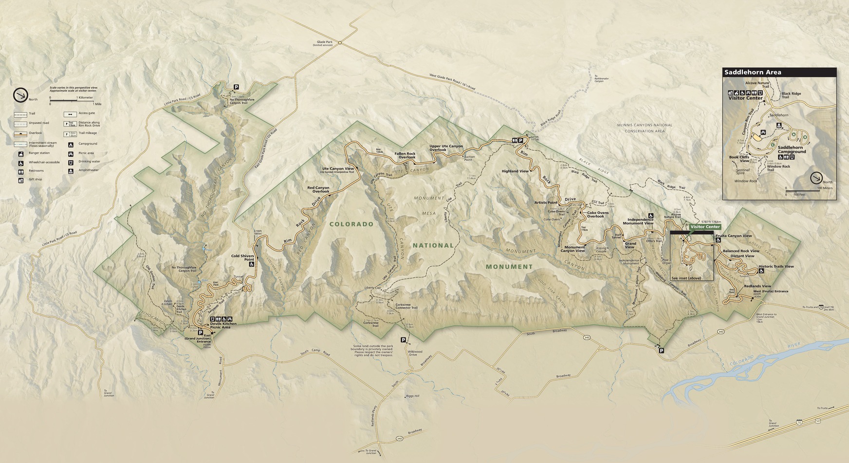 Map of Colorado National Monument in Colorado. The angular outline of the monument, which loosely resembles a teapot with the spout to the left, is green and the surrounding topography shades of tan and beige. 