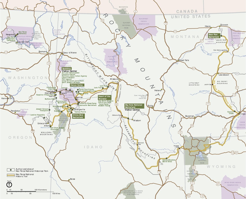 Map of the Nez Perce National Historic Trail, which travels from Oregon through Idaho, Wyoming, and Montana. The trail is shown in dark yellow, park areas in green, reservations in purple, roads in dark brown, and surrounding areas in off white.