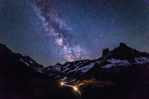 The Milky Way rises in a star-filled, night sky above Liberty Bell Mountain Peak, Washington.