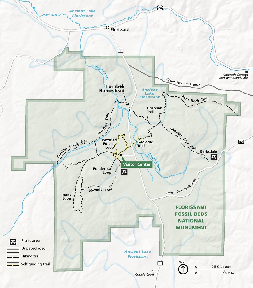 Map of Florissant Fossil Beds National Monument in Colorado. The park, shown in green, is blocky with stepped borders against a pearly white topographic terrain.
