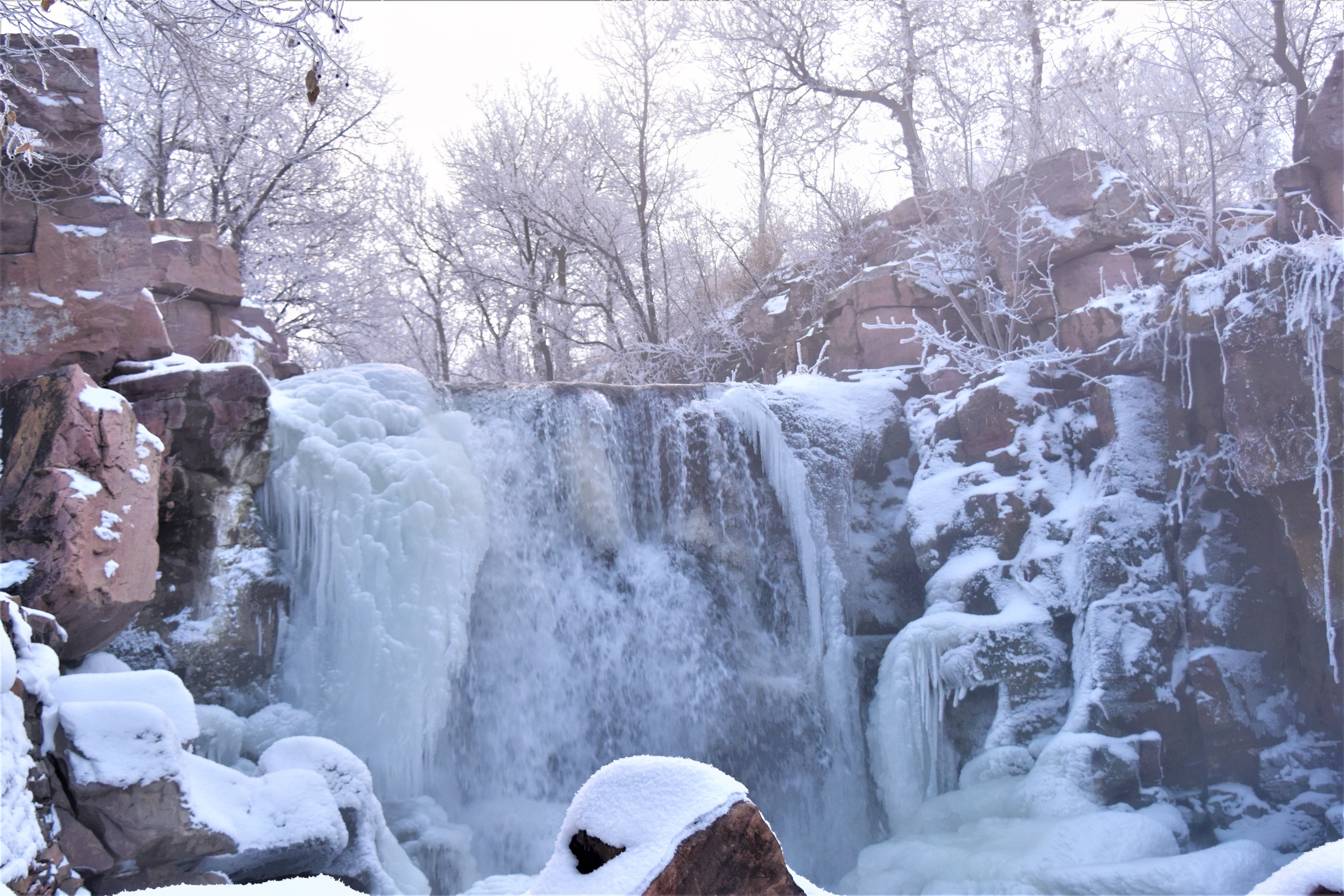 Winter waterfall with ice on the edges.