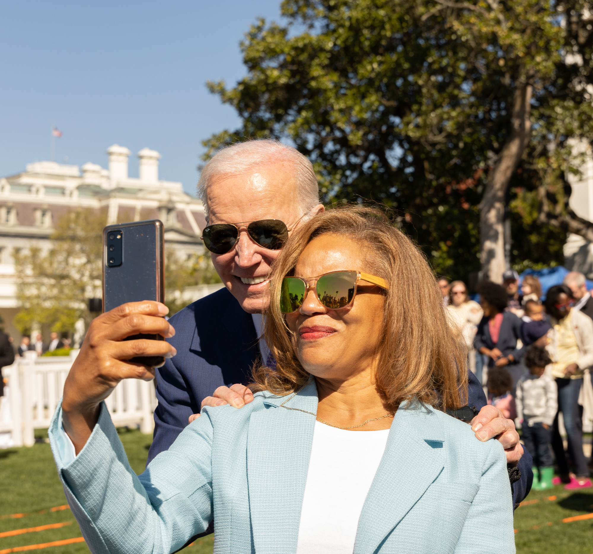 President Joe Biden poses for a photo at the 2023 White House Easter Egg Roll