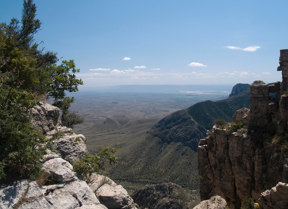 View of lower Pine Spring Canyon from Hunter Peak. Guadalupe Peak Trail visible on opposite ridge.