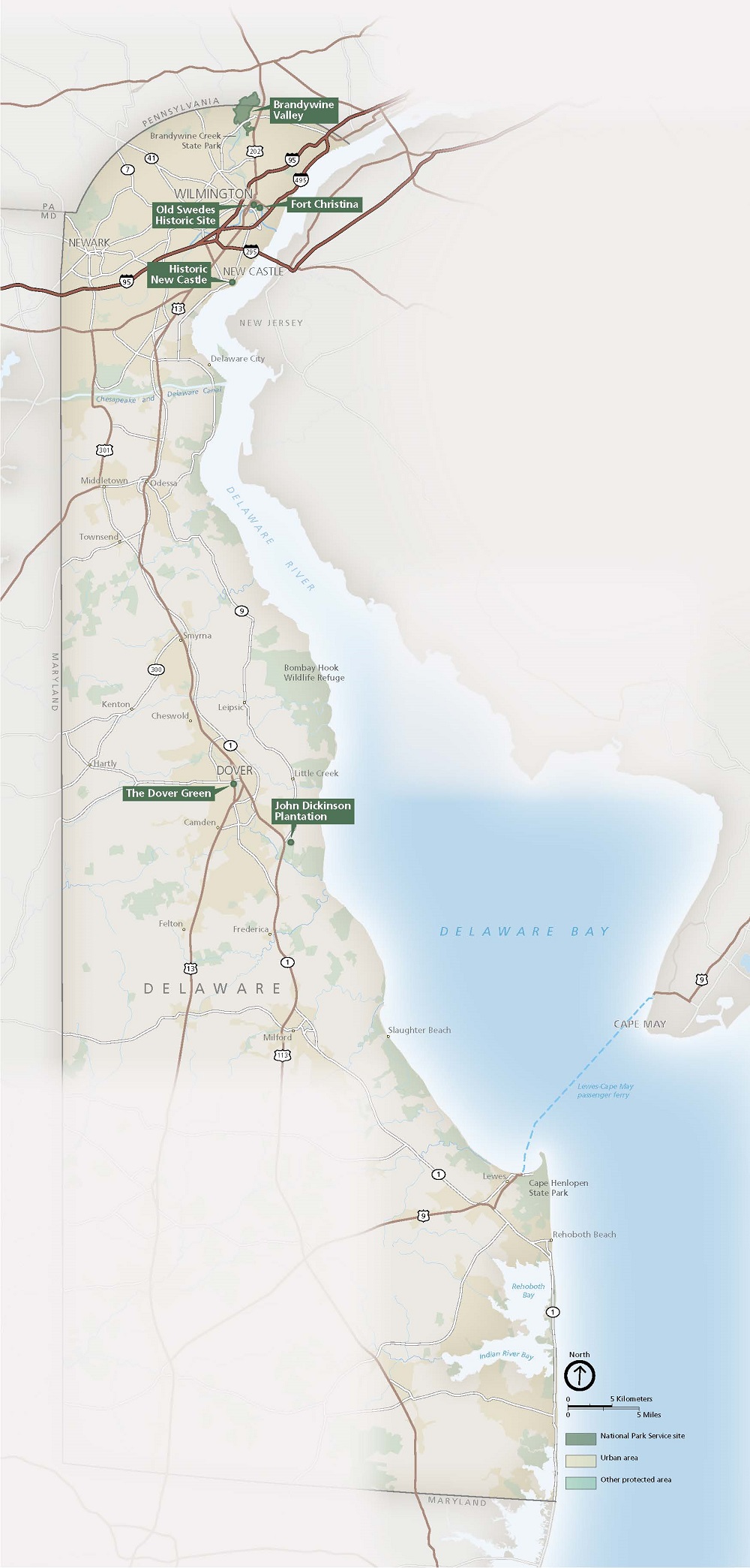 Map of First State National Historical Park in Delaware. The entire state of Delaware is shown in tan with neighboring states labeled and outlined in gray. Landmarks are represented by dark green dots and labels or light green shading. Roads and highways are represented by brown lines.