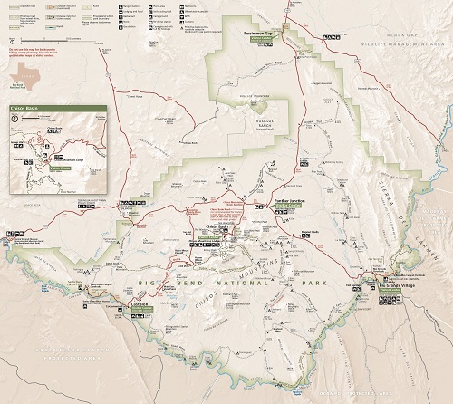 Map of Big Bend National Park in Texas. Outlined in a shade of faint green, the park is roughly oval with stepped borders and two short arms reaching to the northwest from the top and left edges. Surrounding terrain is shown in beige for the US or darker tan for Mexico, and solid red, gray, or black double dashed lines create a web of roads in and around the park.