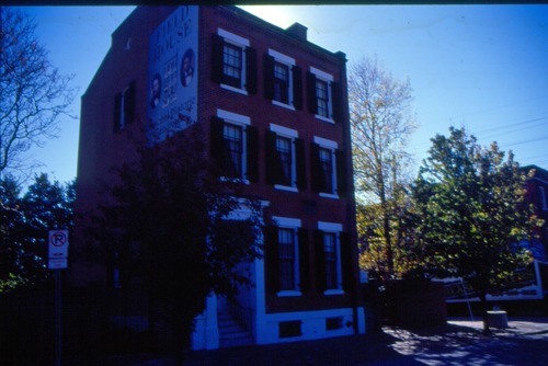 Image of a single three-story row house.