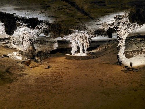 Stone pillars along a cave passage.