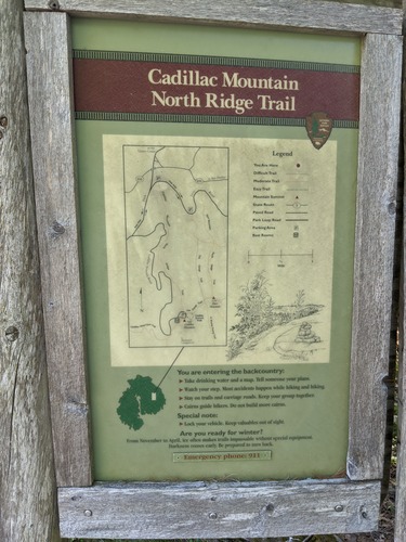 Trail sign with wooden frame