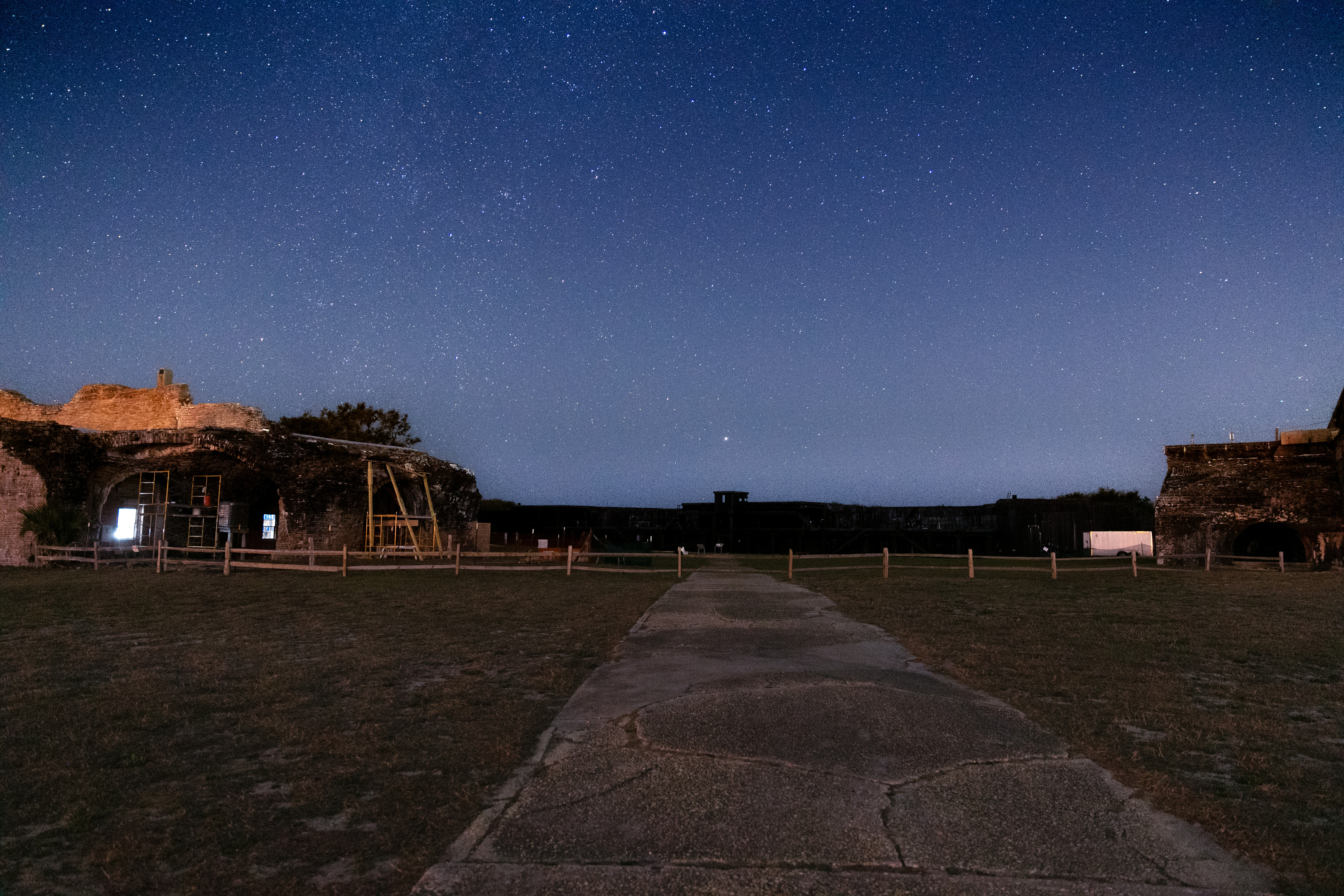 The walkway into Fort Pickens is shrouded by stars.