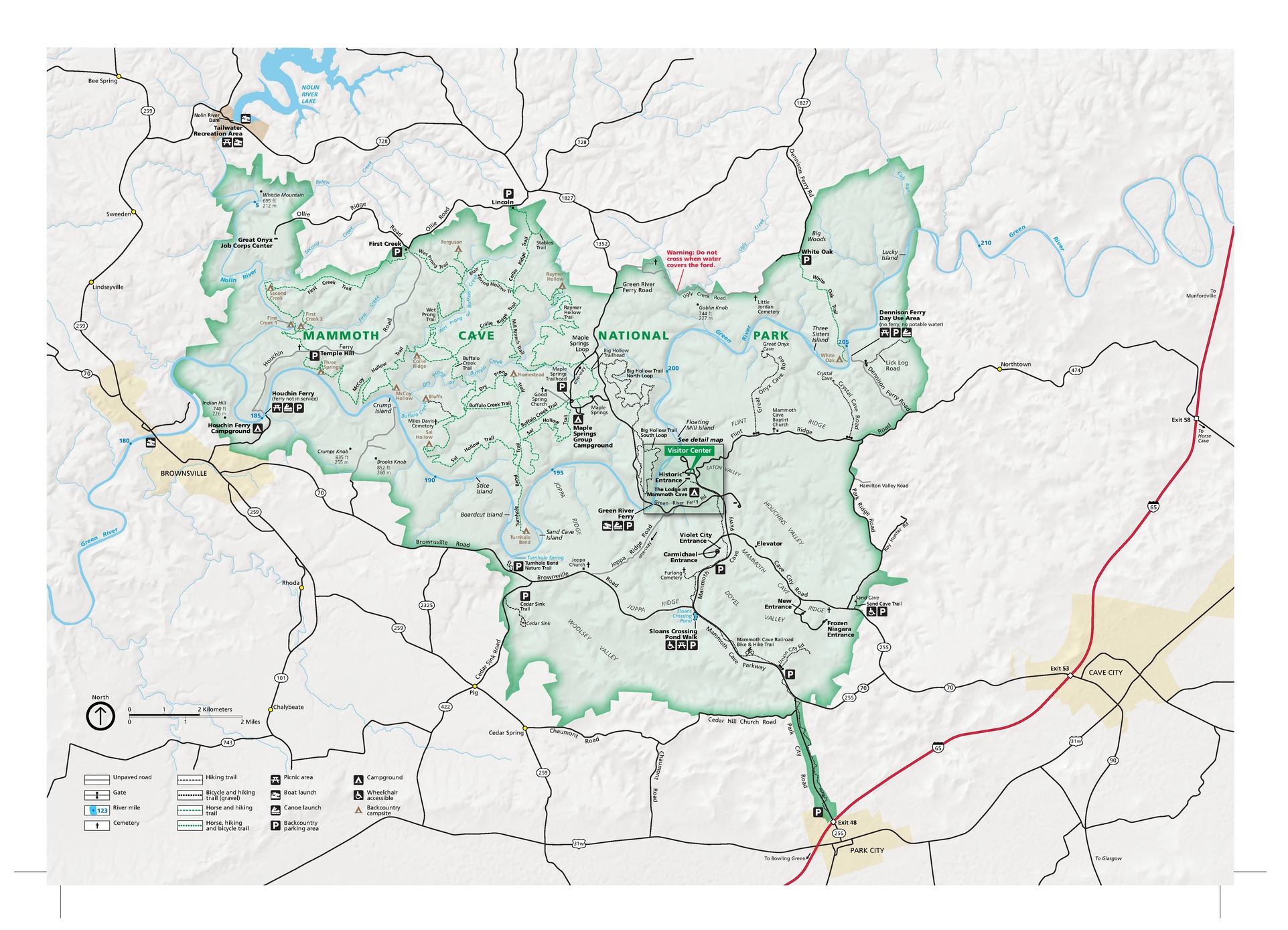 Map of Mammoth Cave National Park in Kentucky. The park area is shown in green, surrounding terrain in ivory white, roads mostly in black, and a few towns in yellow.